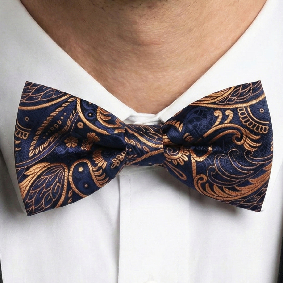 dark blue and gold bow tie